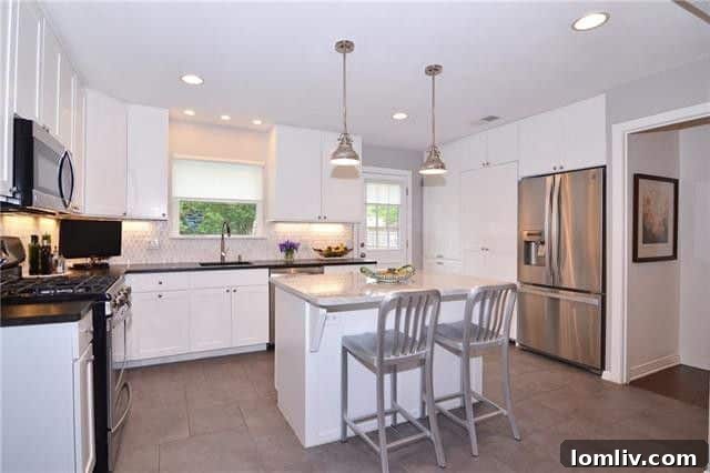 Modernized kitchen flowing into the dining area, perfect for entertaining