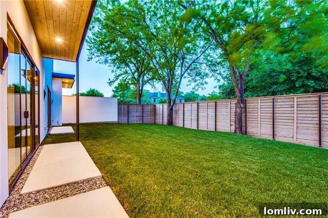 Private backyard with an 8-foot fence and mature trees at 3894 Gaspar Drive