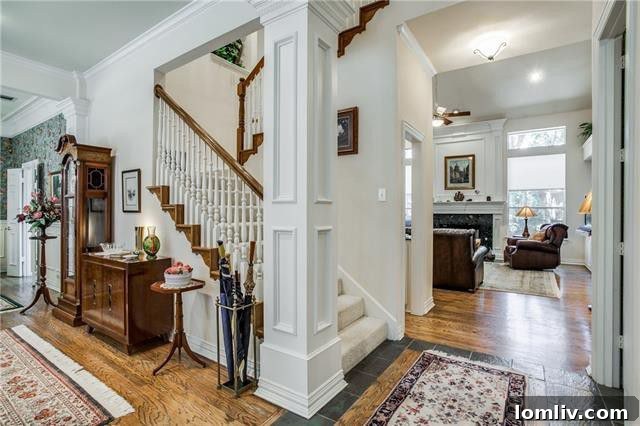 Spacious living room with classic wood floors and a fireplace