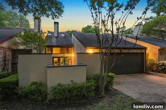 Exterior view of a modern patio home at 9646 Baseline Drive in Lake Highlands, Dallas, featuring a welcoming stone patio and lush landscaping.
