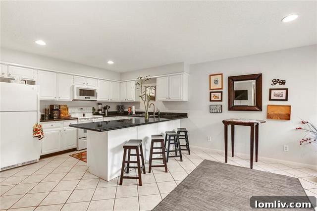 Elegant dining area adjacent to the kitchen, showcasing modern updates and an open layout in this Lake Highlands home.