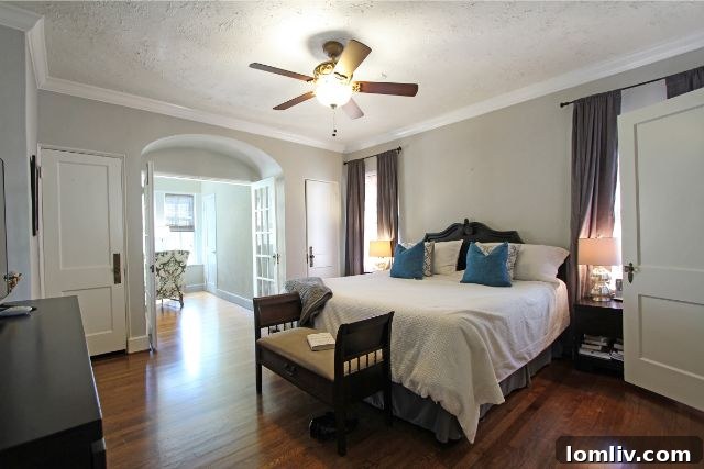 Luxurious Master Bathroom with Modern Fixtures and Historic Charm