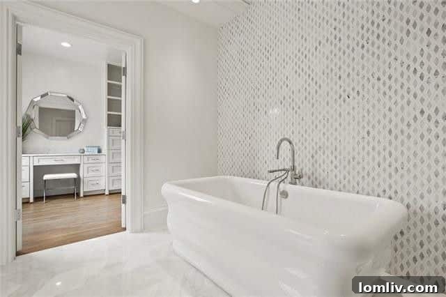 Spacious master bathroom with modern fixtures and a luxurious feel