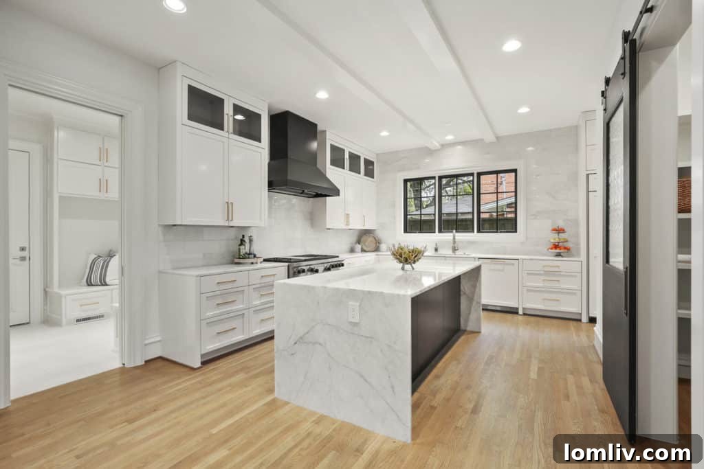 A modern and elegant kitchen with dark accents and unique cabinetry in the luxury Dallas home