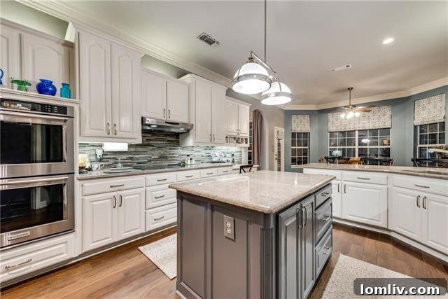 Gourmet kitchen with stainless steel appliances and ample cabinetry