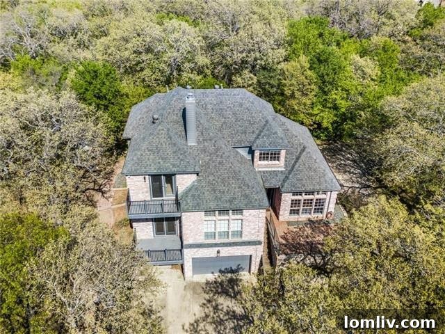 Cozy living room with fireplace and views of the wooded lot