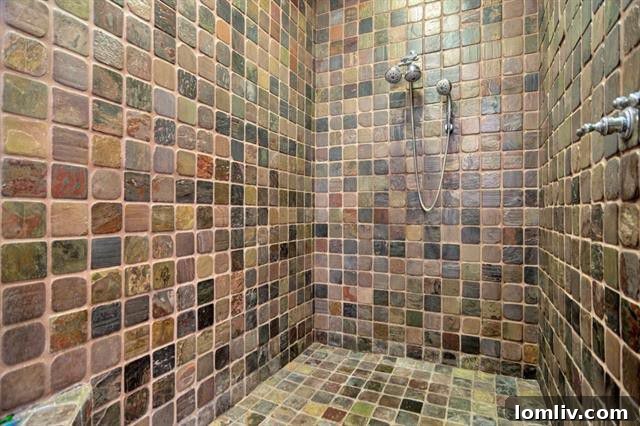Master bathroom with eclectic tile shower and modern vanity
