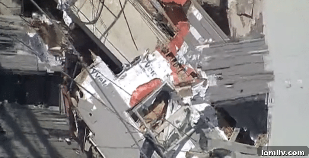 Another harrowing view of the Deep Ellum crane collapse aftermath, highlighting the extensive structural damage to the apartment complex.