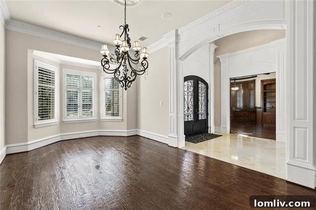 Frisco Starwood Luxury Residence Commands $2.3 Million 4 Grand entrance with double iron doors and circular driveway at Frisco luxury home