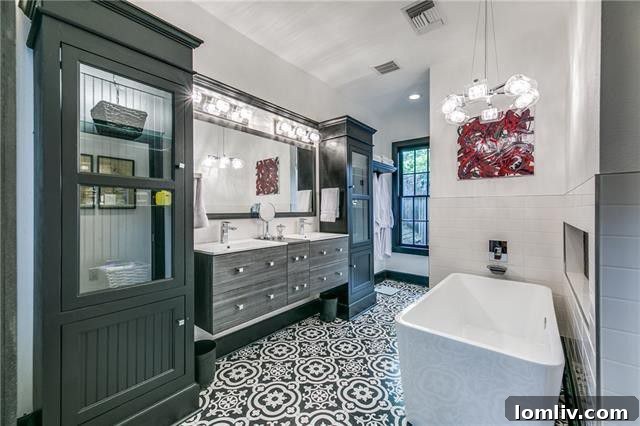 Elegant living room with fireplace and hardwood floors in Tudor home