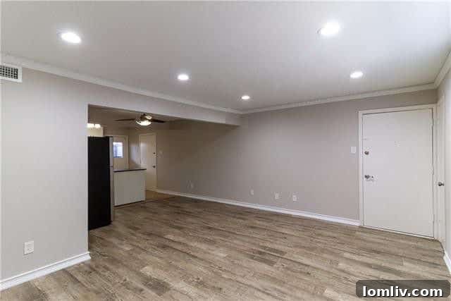 Stylish and comfortable living room area with fresh paint and new flooring, ready for personalization