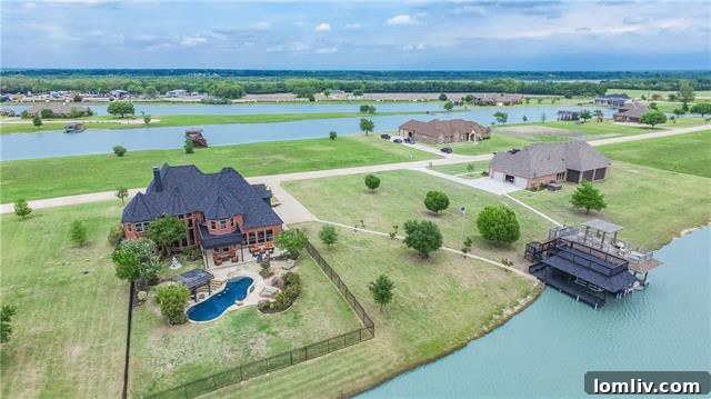 Panoramic view of Princeton Lakes with a waterfront home and serene water