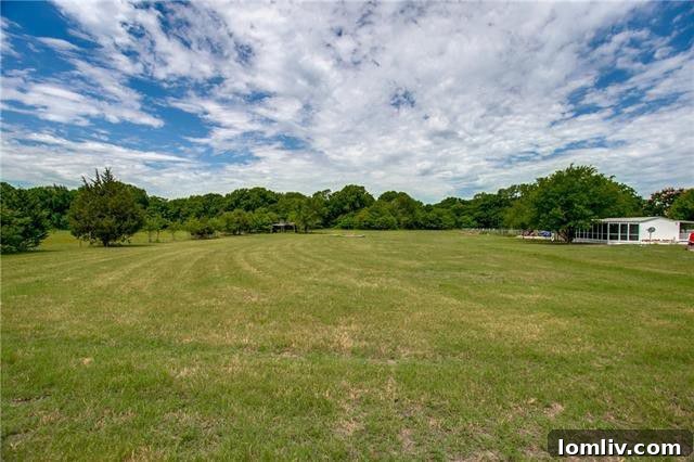 Horse stalls and a large riding arena on the Princeton equestrian property