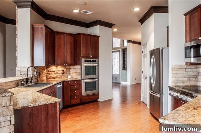 Spacious kitchen with modern appliances and island in a lakefront property
