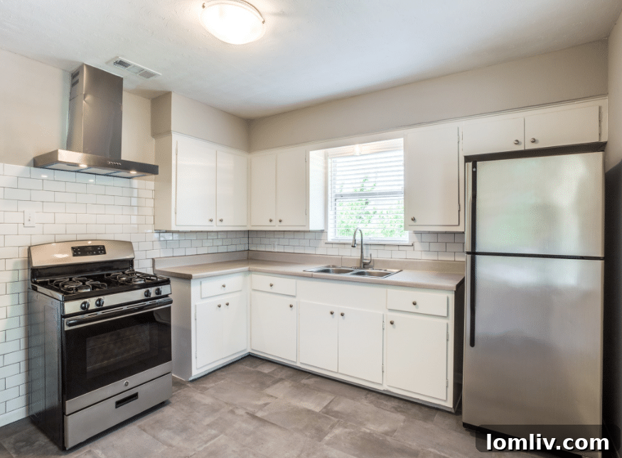 Bright living room with hardwood floors and natural light in a North Oak Cliff duplex unit