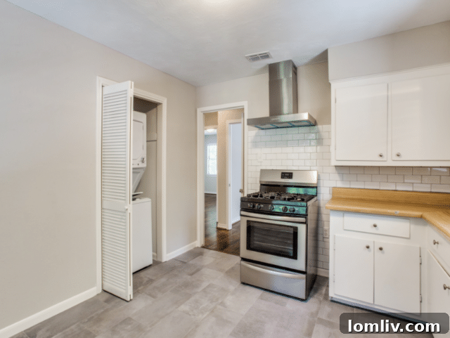 Spacious, landscaped backyard with mature trees and covered patio for a North Oak Cliff duplex