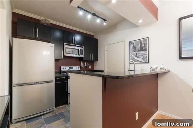 Bright kitchen and dining area in the affordable Lake Highlands condo, offering practical and modern finishes