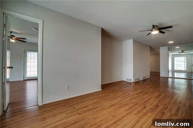 Bright and spacious living room with a cozy wood-burning fireplace, a key feature of this Dallas rental home