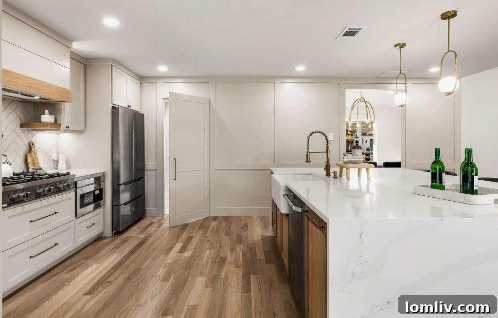 Elegant kitchen interior with a cleverly disguised door blending into the cabinetry