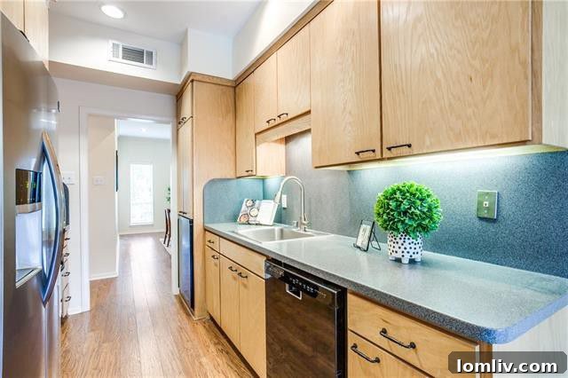 Inviting gated community pool surrounded by attractive landscaping in Preston Royal Dallas