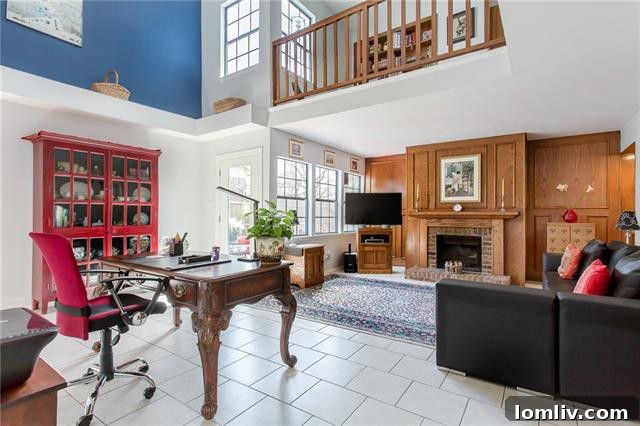 Inviting interior view of an open two-story living area with abundant natural light
