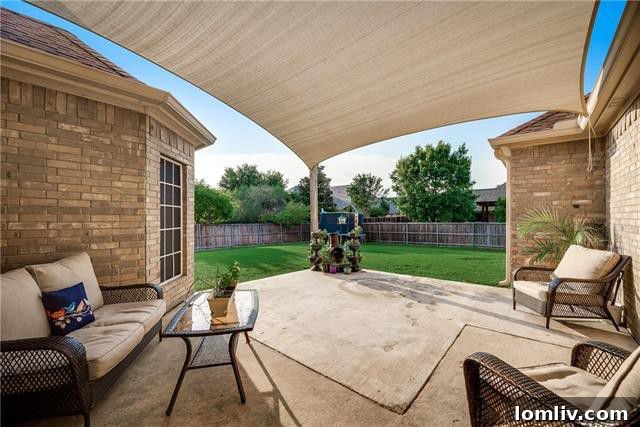 Grand entrance and living area with high ceilings
