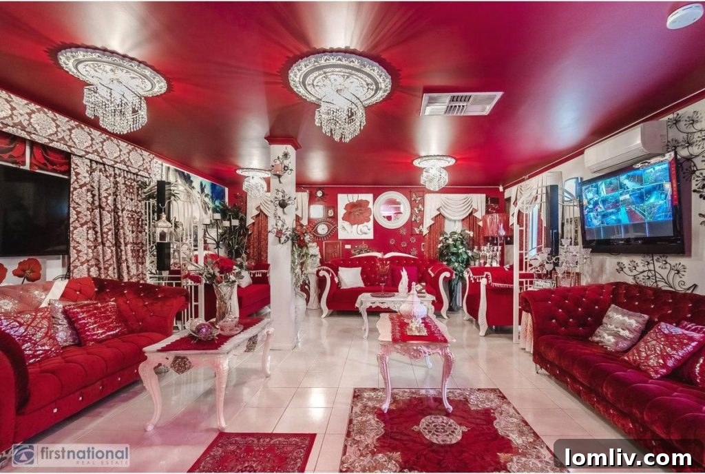 A closer look at the bold red carpet and matching drapes in a living area, accented with gold furniture.