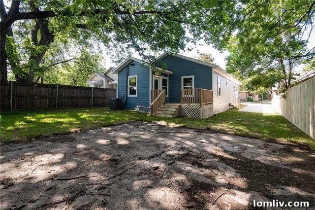 Shady backyard oasis with mature trees at 1410 East 9th Street