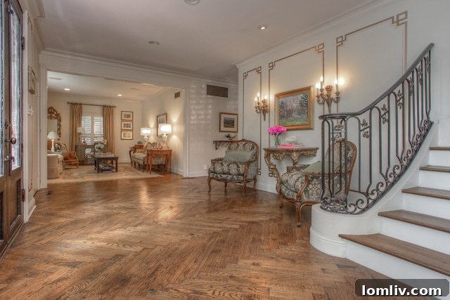 Luxurious living room interior with herringbone wood floors and elegant furnishings at 3828 Monticello Drive