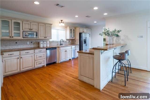 Luxurious master bedroom with sitting area in a Devonshire Dallas home