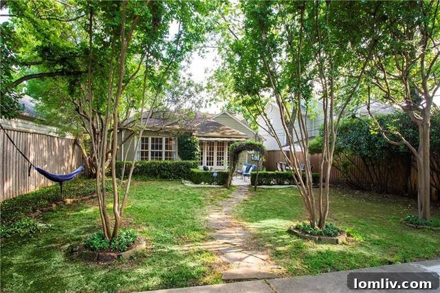 Backyard oasis with hammock and lush greenery in a Briarwood home