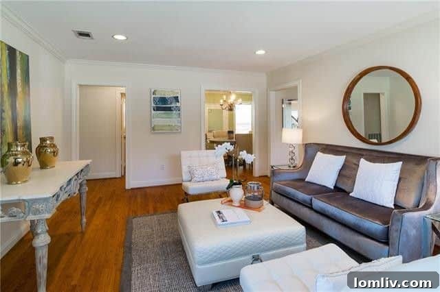 Spacious living room with fireplace and natural light in Dallas Devonshire property