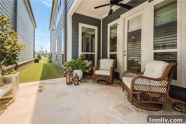 Stylish side yard patio with Austin Stone and astroturf, perfect for entertaining