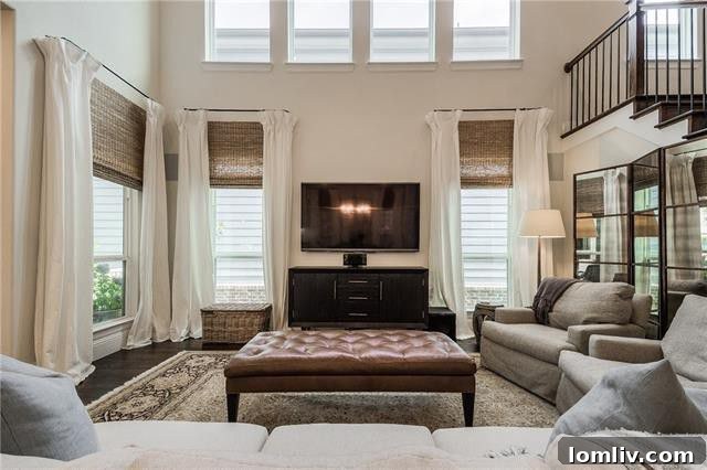 Elegant kitchen island with quartz countertops and pendant lighting