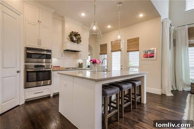 Detailed view of elegant kitchen cabinetry with custom hardware