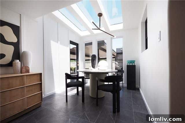 Modern kitchen with waterfall granite counters and stylish decor in a renovated home