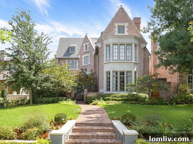 Elegant facade of the updated English Cotswold manor house, showcasing sophisticated design improvements
