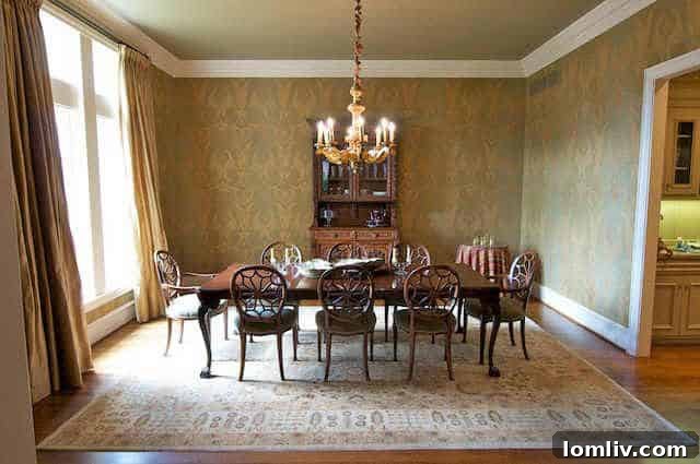 Dining room of English Cotswold manor before renovation, showing traditional decor