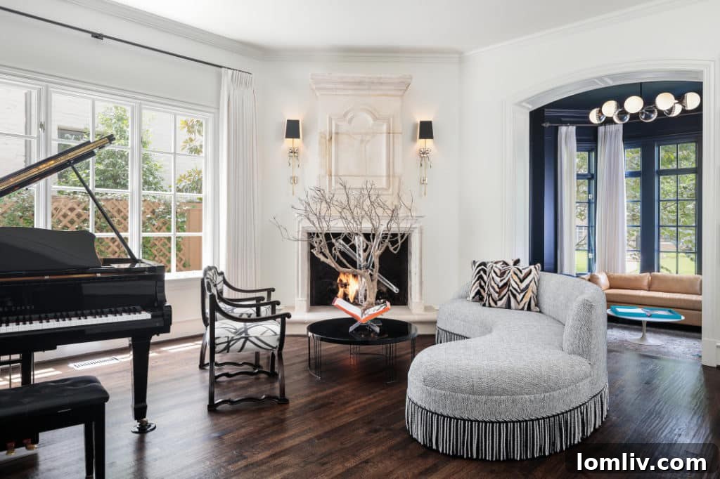 Living room of English Cotswold manor after renovation, featuring elegant modern furnishings