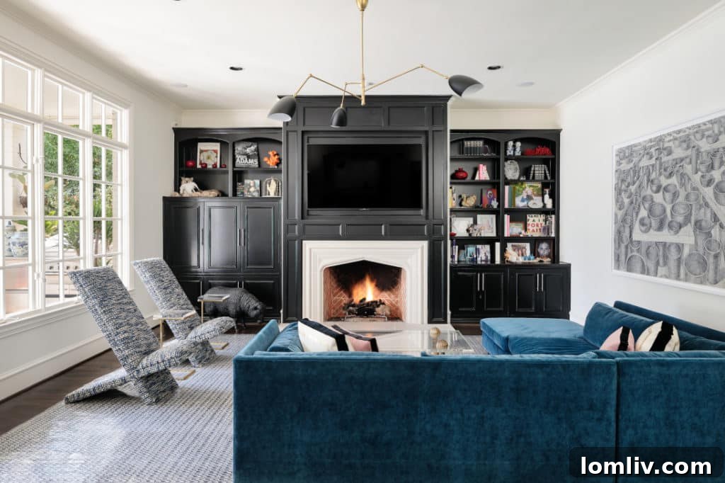 Spacious living room of English Cotswold manor after renovation, highlighting refined decor and natural light