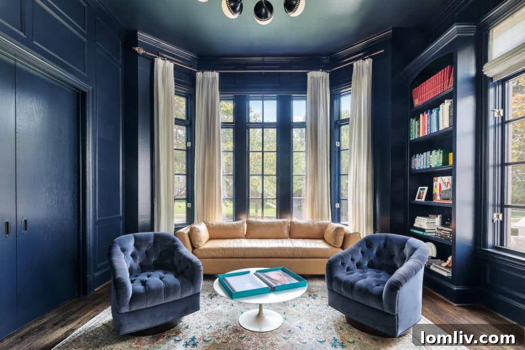 Luxurious seating area within the renovated English Cotswold manor's living room