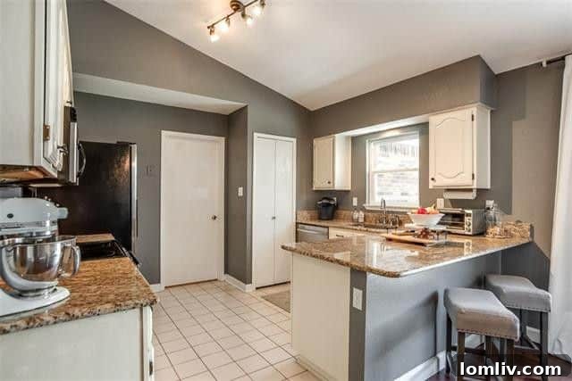 Master bathroom with dual sinks and granite countertops, The Colony
