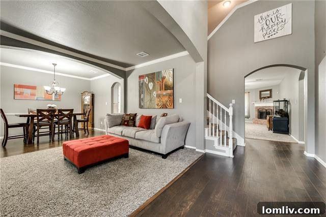 Spacious living room with elegant wood floors, The Colony executive home