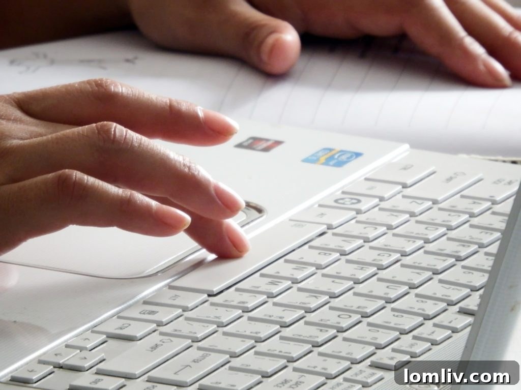 Close-up of a finger pressing a computer keyboard key, symbolizing tech work and innovation.