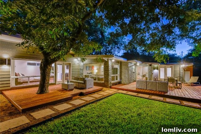 Spacious and private backyard with mature trees, offering a serene retreat