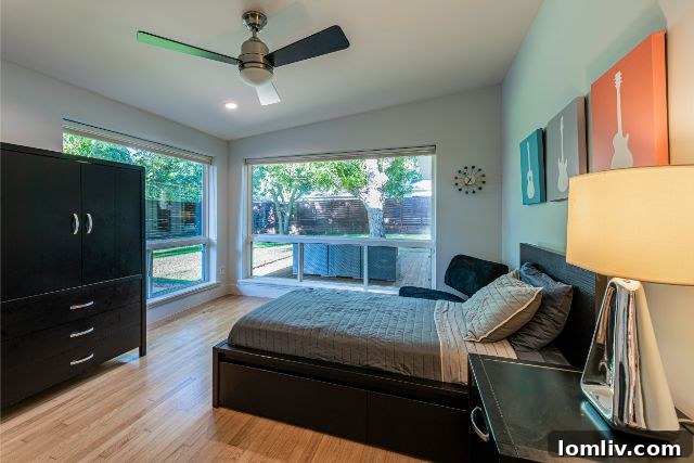 Luxurious master bathroom featuring dual vanities and an elegant freestanding tub