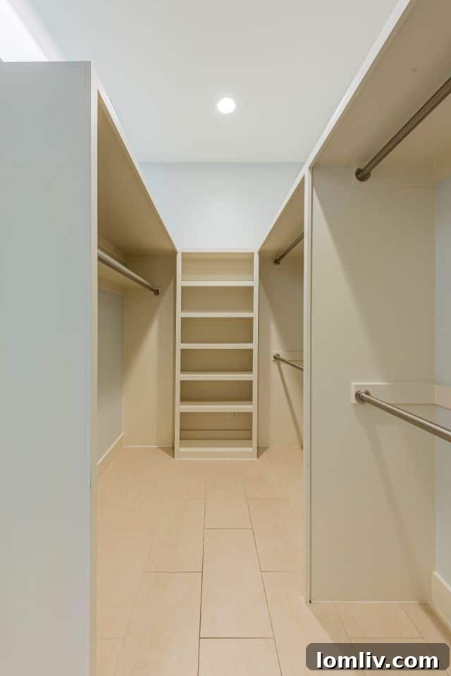 Elegant freestanding bathtub in a brightly lit, modern bathroom