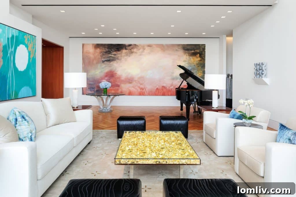 The sophisticated Hall-Living-room features a glass coffee table filled with gold leaf by E. Klein, exemplifying the penthouse's artistic flair.