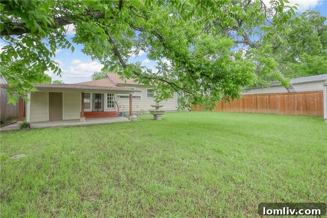 Large Backyard with New Fence in Dallas Home
