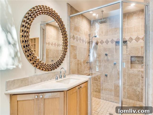 Gourmet kitchen featuring exotic granite countertops, double ovens, and stainless steel gas range in a modern Farmers Branch residence.